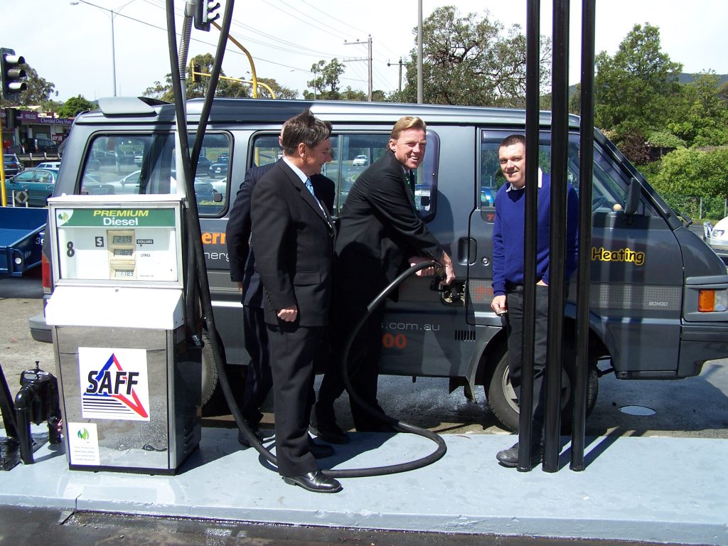 John Thwaites filling Colin Gillam's vehicle with biodiesel